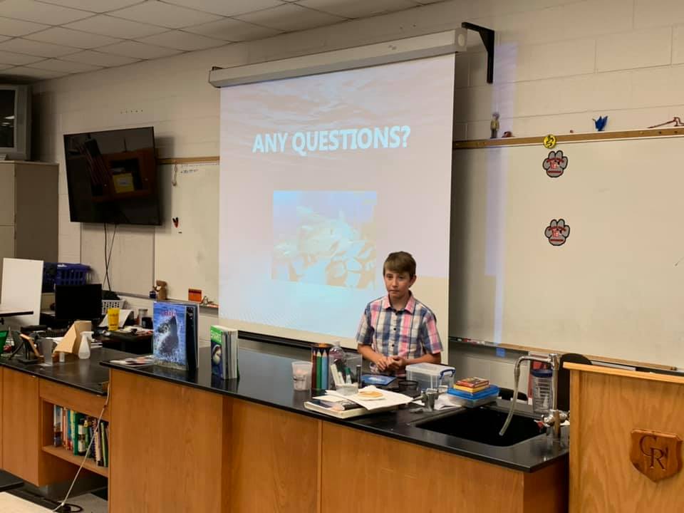 boy giving presentation