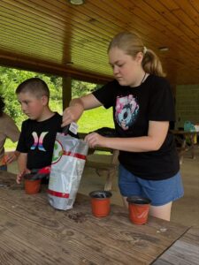 Youth planting Venus Fly Traps